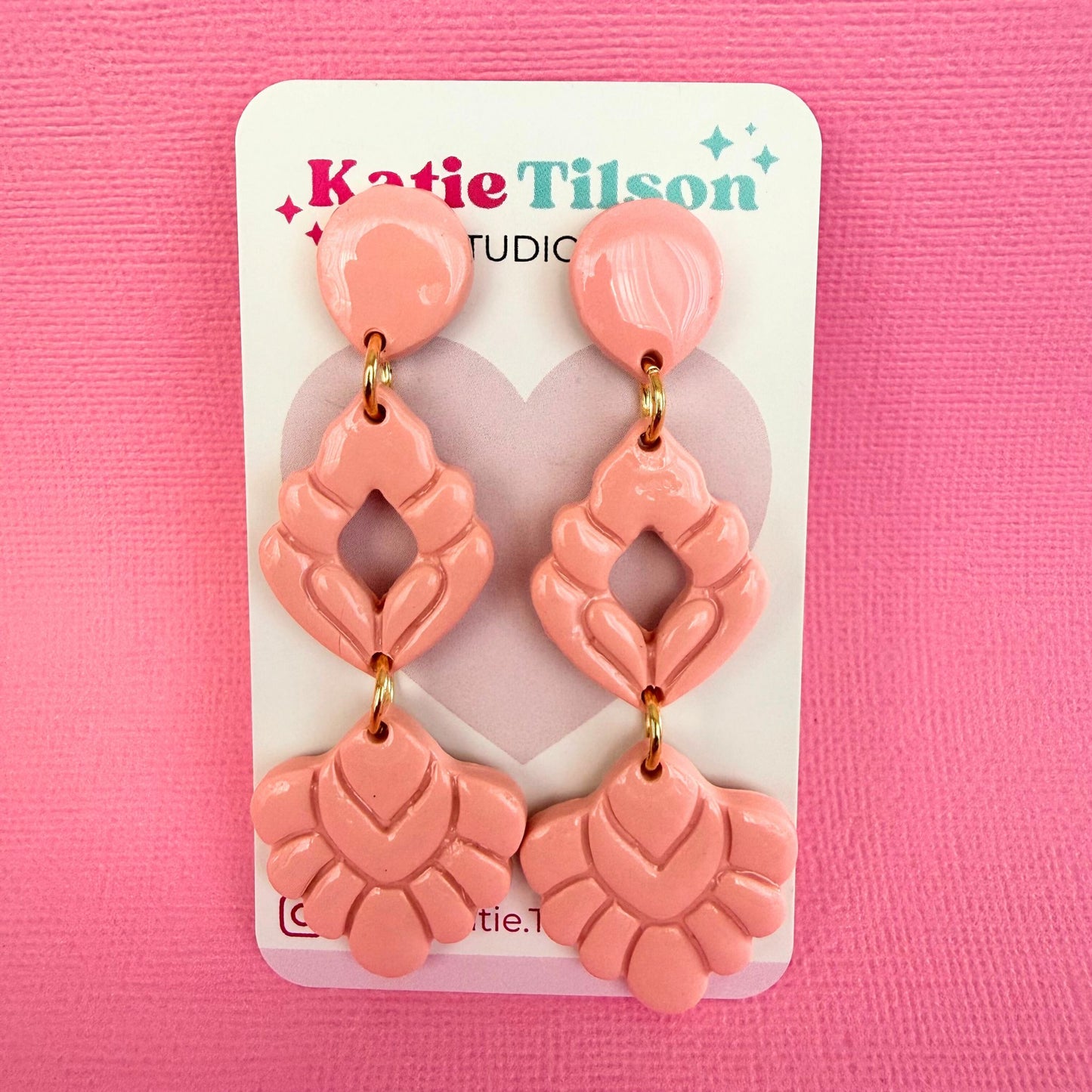 Australian handmade pink drop earrings on a Katie Tilson Studio card against a pink background.