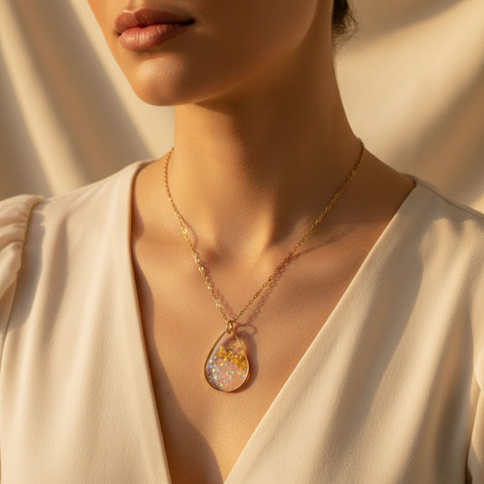 Woman wearing Golden Light Australian handmade necklace with gold leaf and soft shimmer by Katie Tilson Studios
