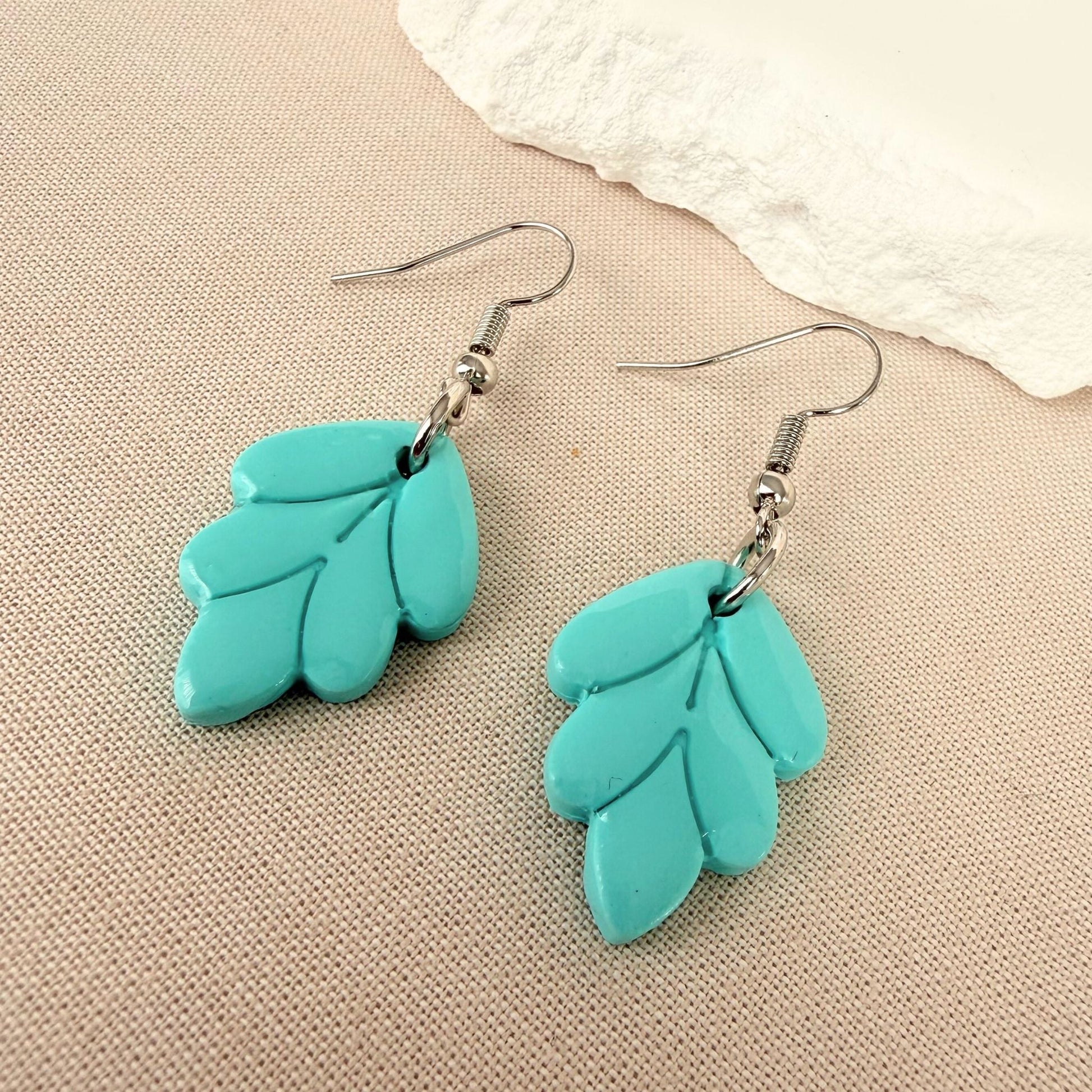 Australian handmade earrings Aqua Leaf - aqua leaf shaped polymer clay dangle earrings with silver hooks.
