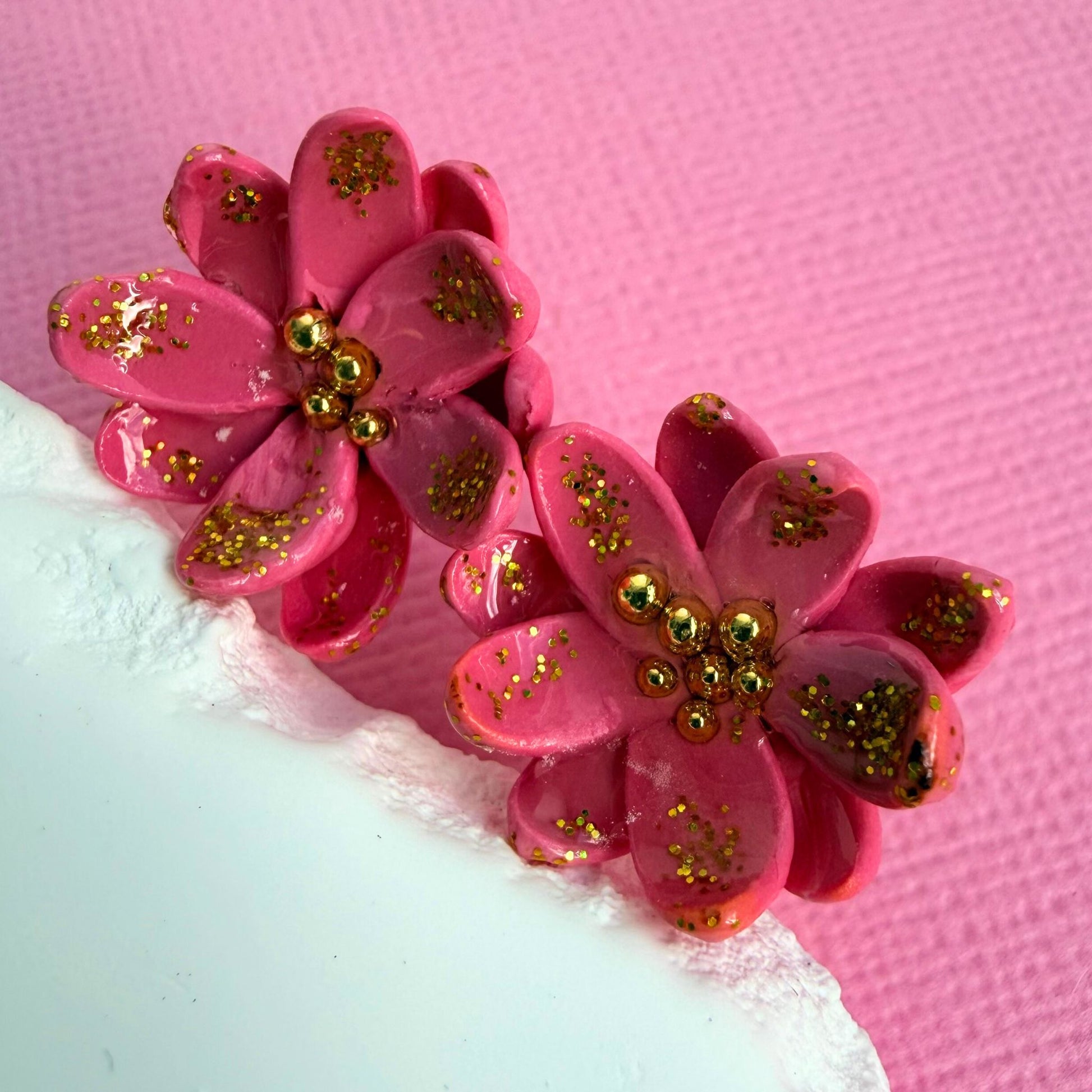 Close-up of lightweight handmade stud earrings Blush Petal Studs