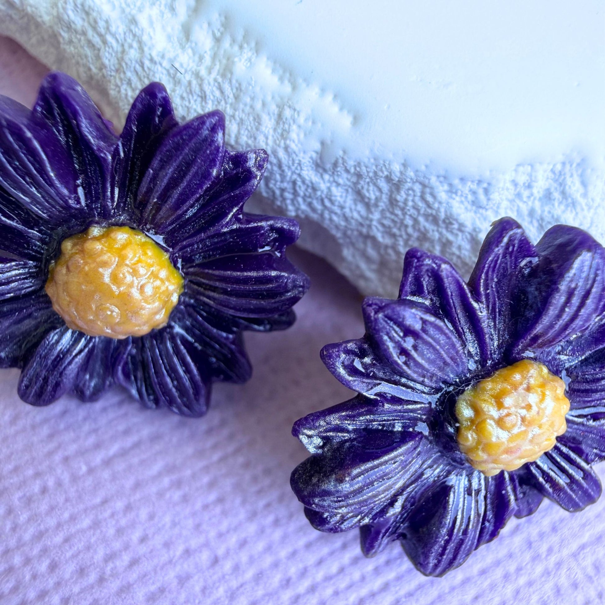 Close-up of lightweight handmade stud earrings Daisy Days
