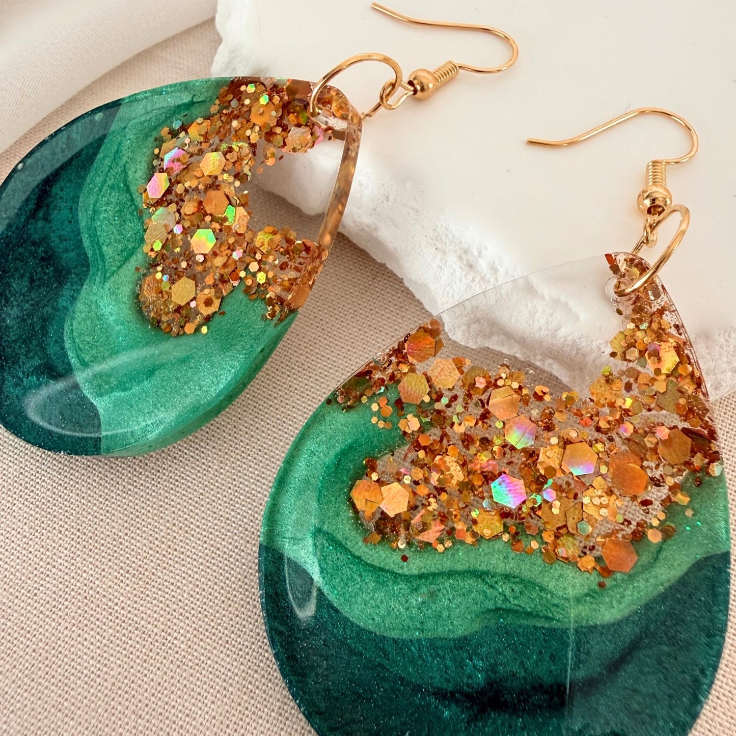 Close up of lightweight handmade statement earrings Emerald Geode in large size