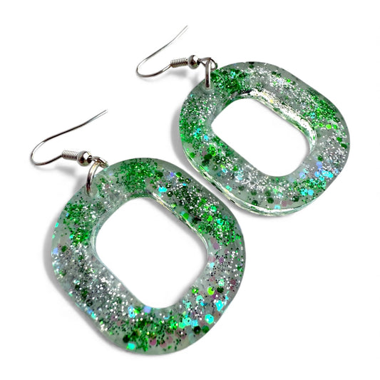 Green glitter hollow oval resin dangle earrings with nickel-free silver hooks.