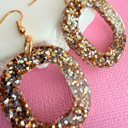 Close up of lightweight handmade dangle earrings Gold Digger