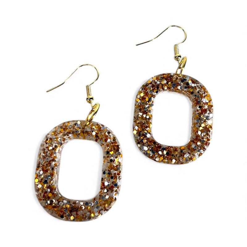 Gold glitter-infused resin dangle earrings with bold sparkle and a high-shine finish on a white background.