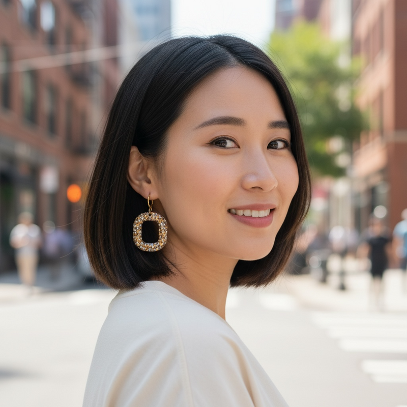 gold digger gold and silver glitter resin earrings worn on model