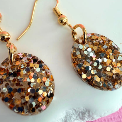 Close up of lightweight handmade dangle earrings Golden Gleam