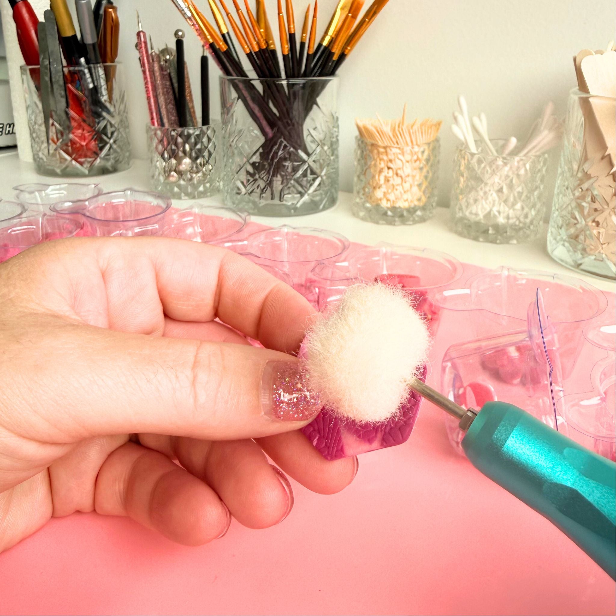 Handmade earrings being sanded in the Katie Tilson Studios workshop