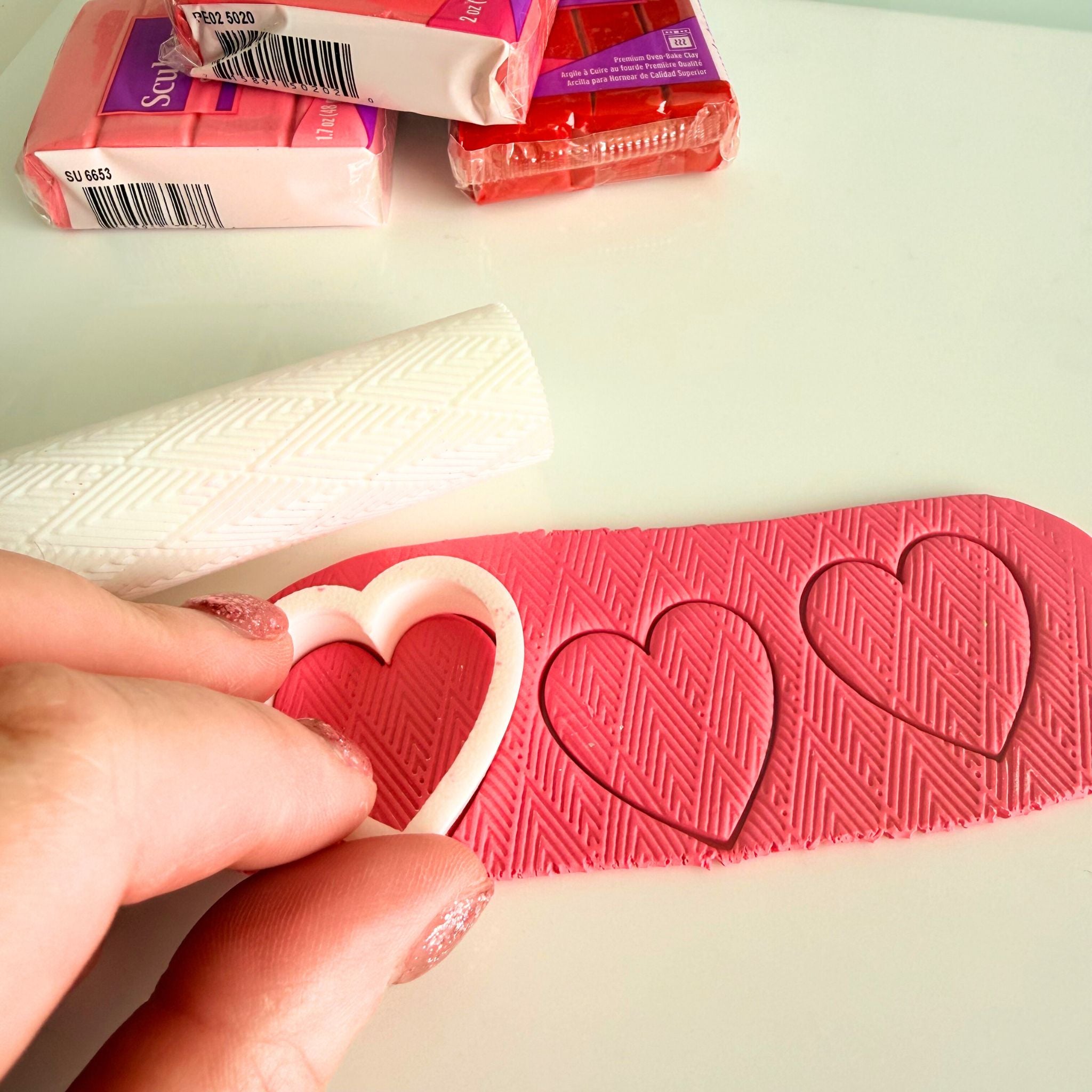 Handmade earrings being created in the Katie Tilson Studios workshop