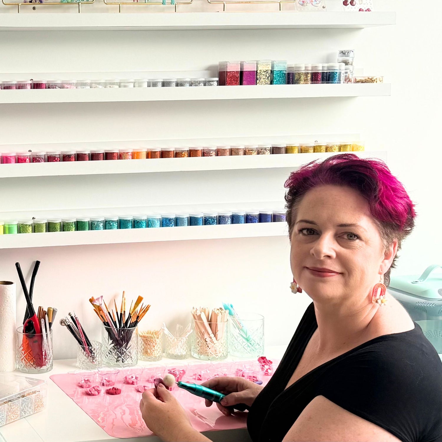 Katie Tilson, maker behind Katie Tilson Studios handmade earrings at work in her studio