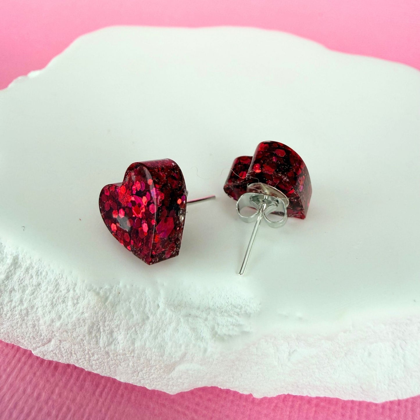 Handmade stud earrings Heartfelt Sparkle Studs shown in pink colour option with silver findings