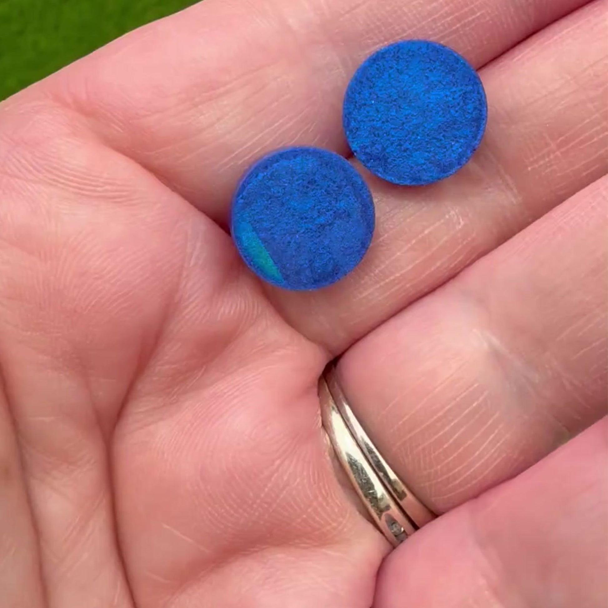 Video of Australian handmade stud earrings Holographic Shimmer showing colour shift effect