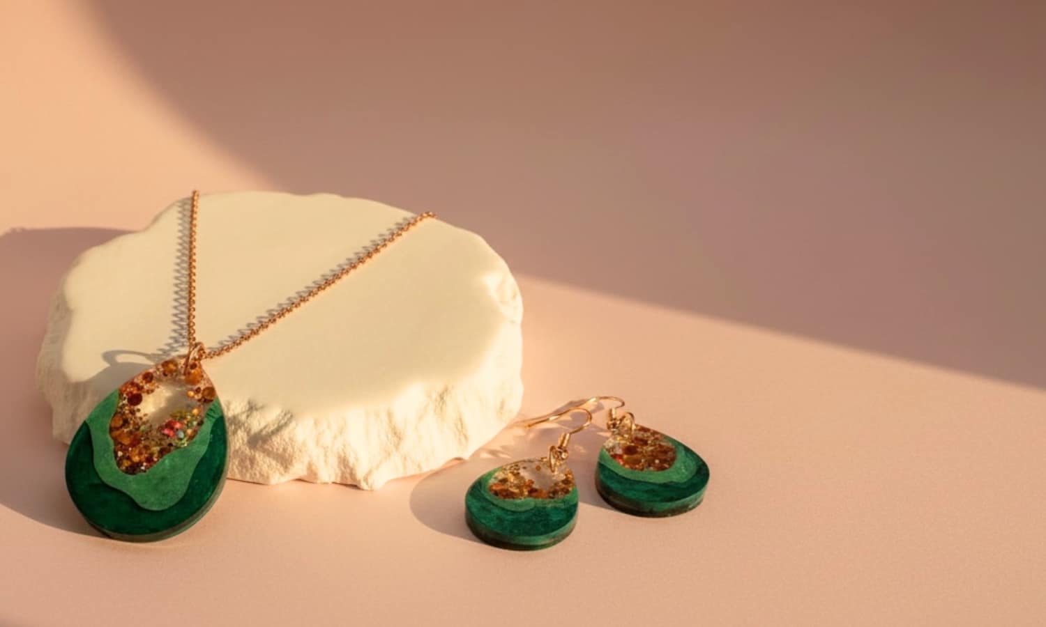 Handmade Australian jewellery by Katie Tilson Studios featuring lightweight teardrop earrings and necklace on a soft blush background.