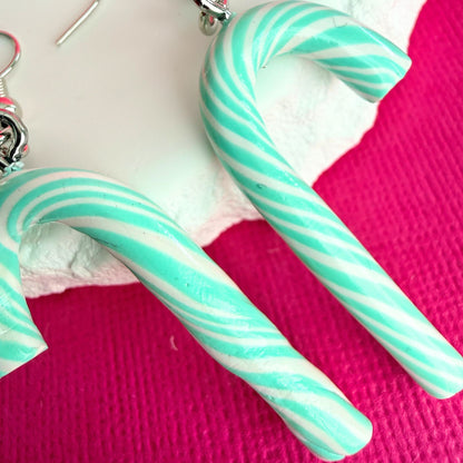 Close up of lightweight handmade dangle earrings Mint Frost Candy Canes