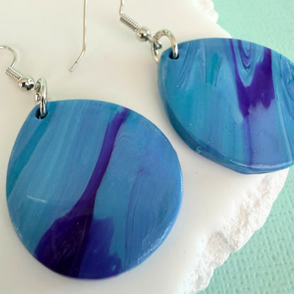 Close up of lightweight handmade dangle earrings Pastel Tide
