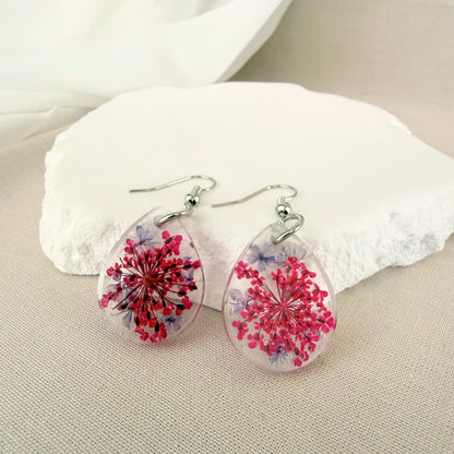 Australian handmade dangle earrings Petal Drift Teardrops with pink and purple flowers embedded in transparent resin.