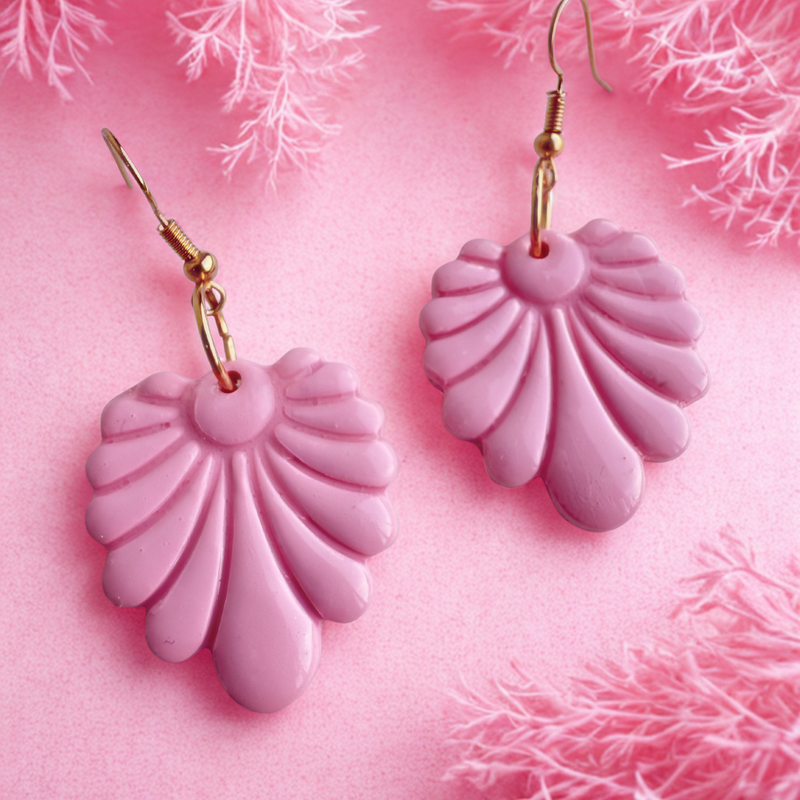 Pink delight vintage inspired polymer clay earrings on a pink background.