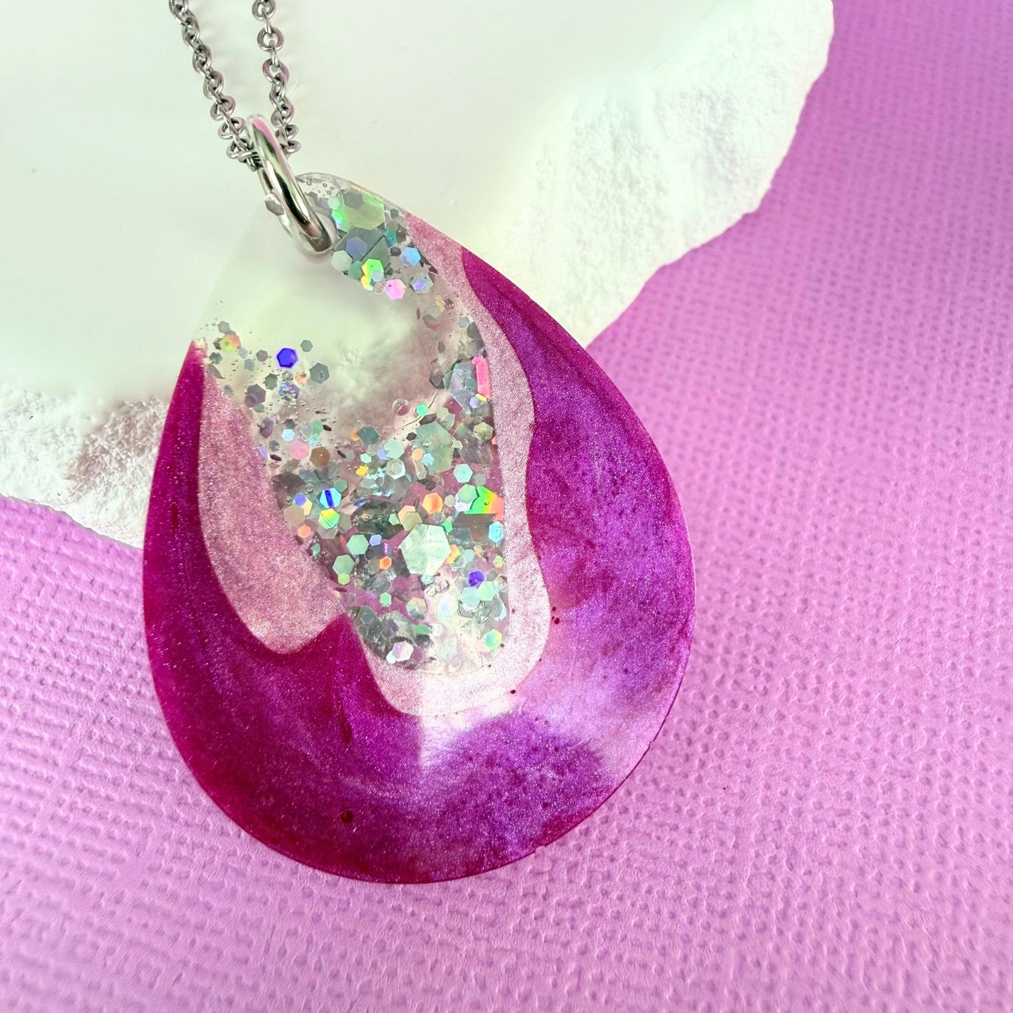 Close up of lightweight handmade resin necklace Pink Geode
