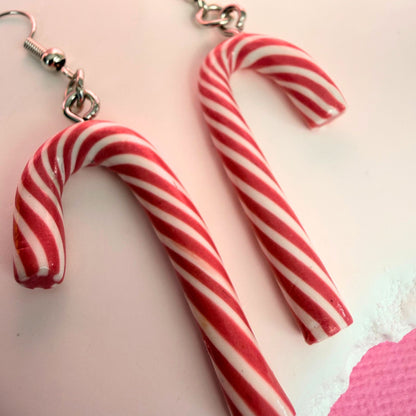 Close up of lightweight handmade dangle earrings Pink Peppermint Candy Canes