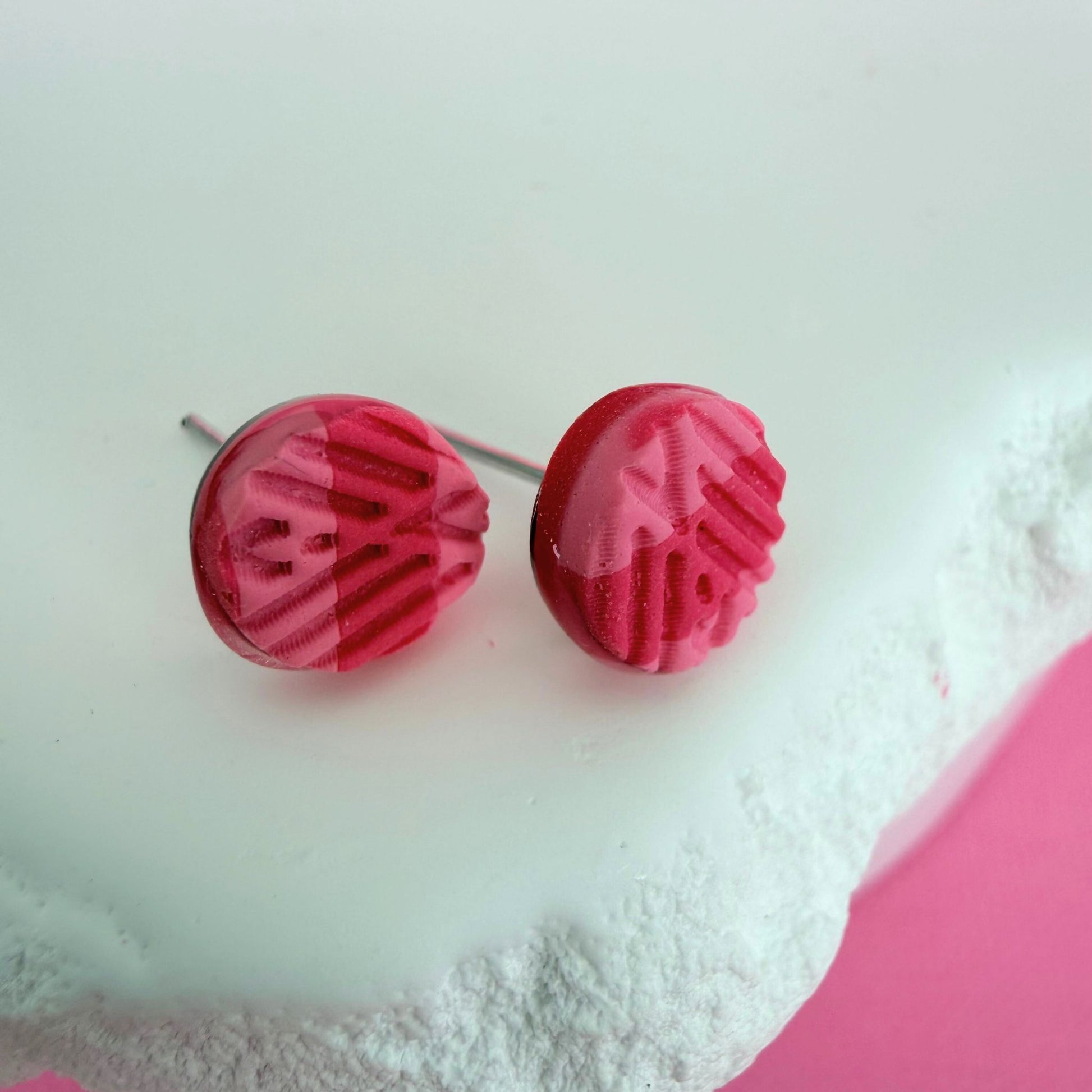 Australian handmade pink textured stud earrings on a white background.