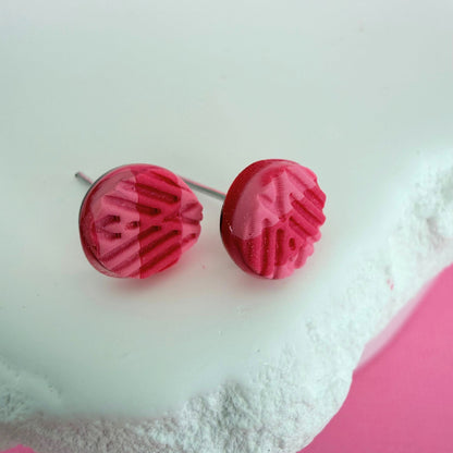 Australian handmade pink textured stud earrings on a white background.