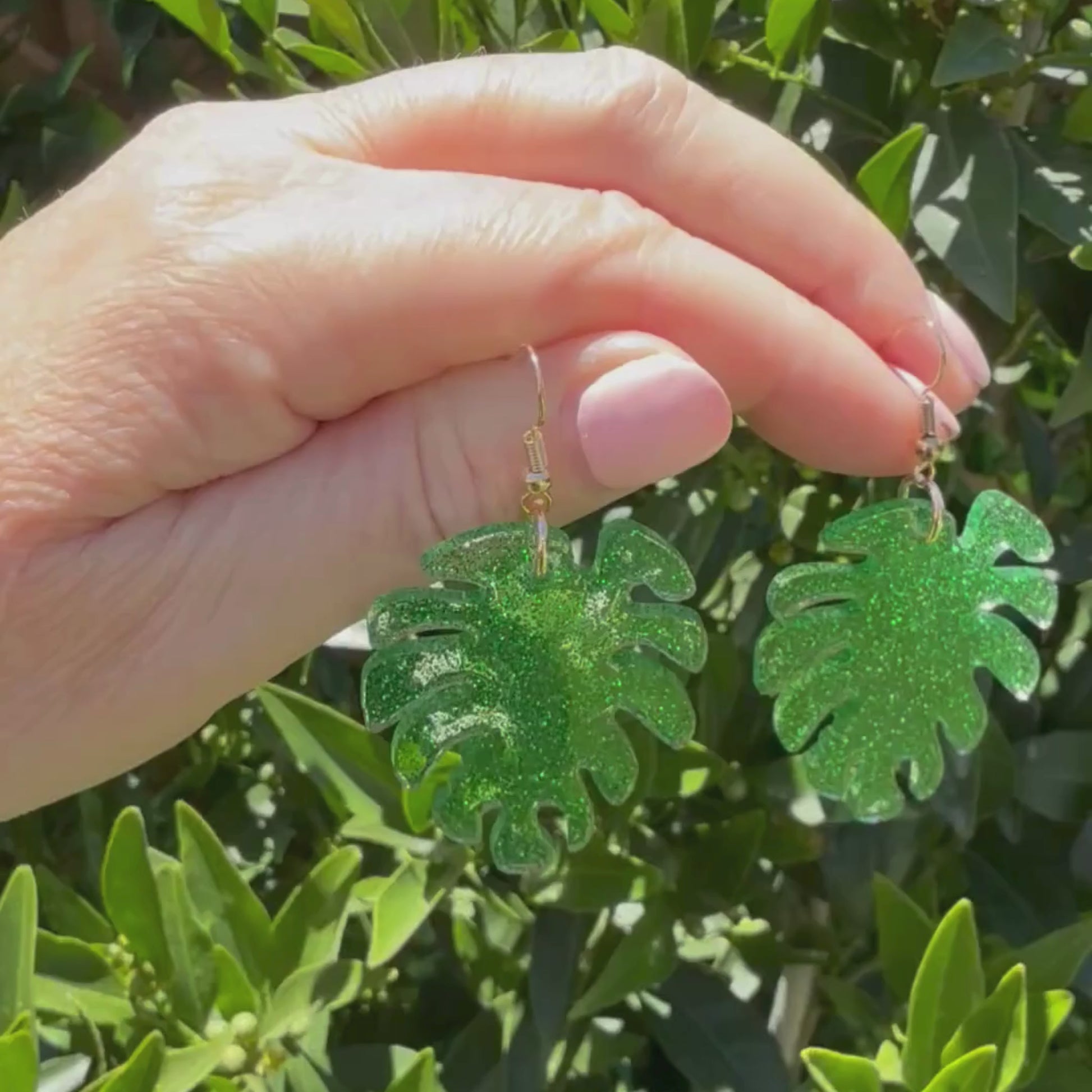 Video of Australian handmade dangle earrings Monstera Magic showing playful movement