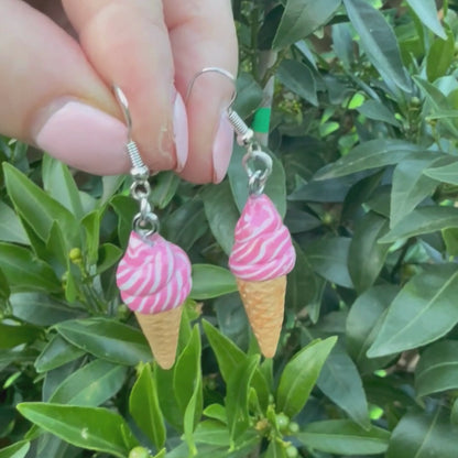 Video of Australian handmade dangle earrings Strawberry Swirl Soft Serve Cones showing playful movement