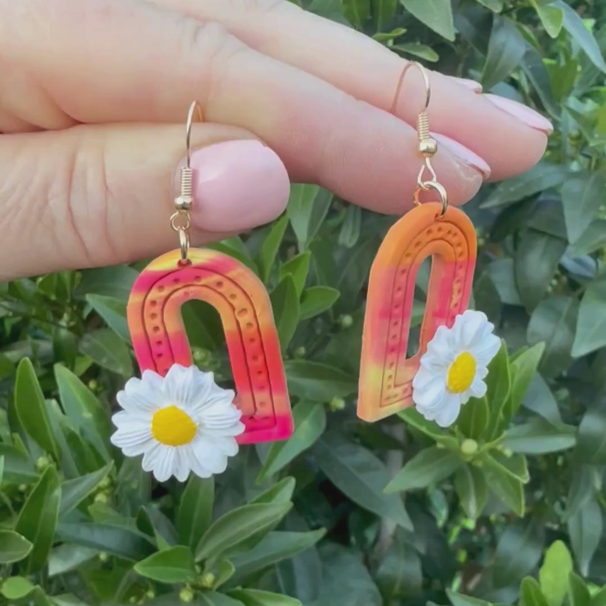 Video of Australian handmade dangle earrings Sunrise Daisy Arches showing playful movement
