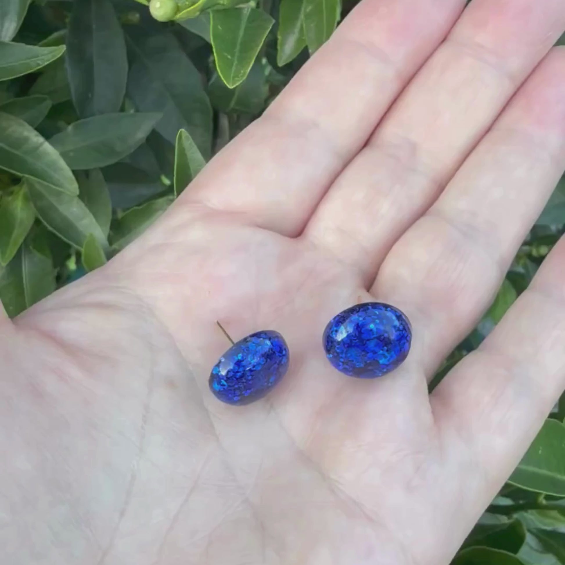 Video of Australian handmade stud earrings Midnight Glow showing lightweight movement