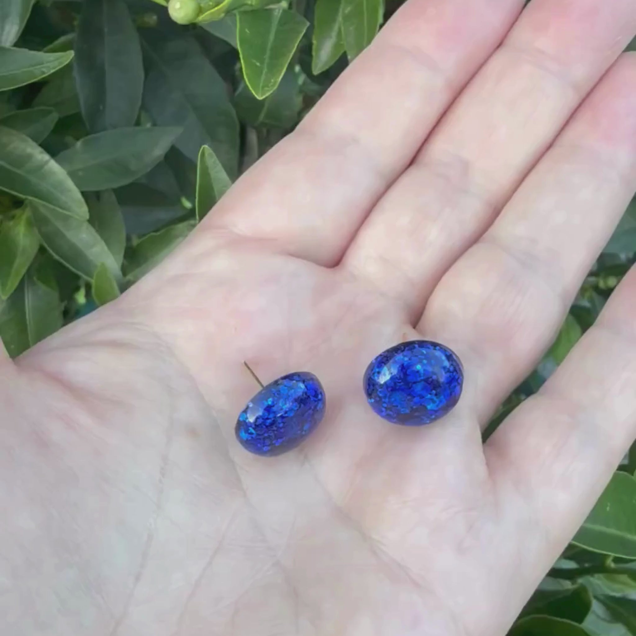 Video of Australian handmade stud earrings Midnight Glow showing lightweight movement
