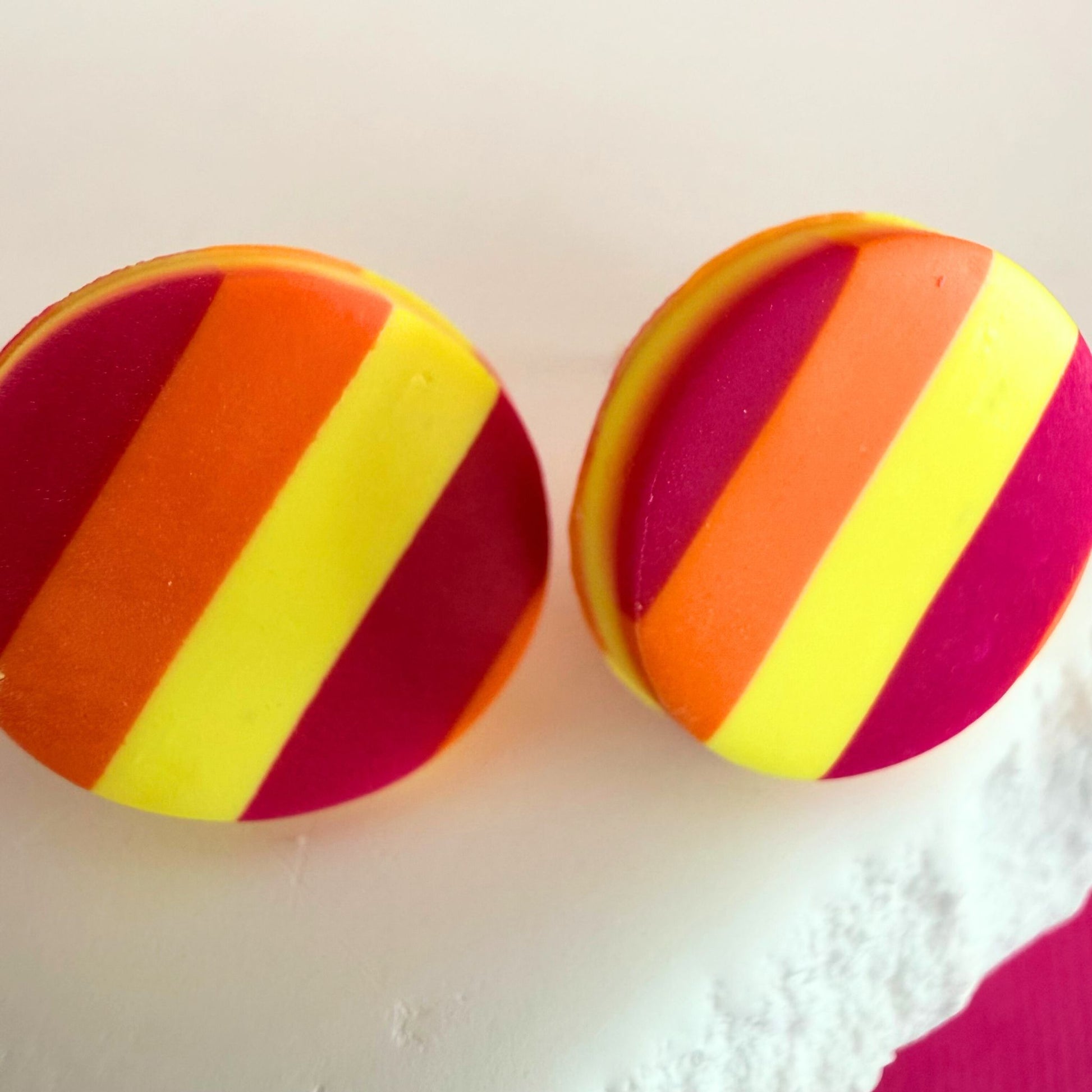 Close up of lightweight handmade stud earrings Sunset Pop