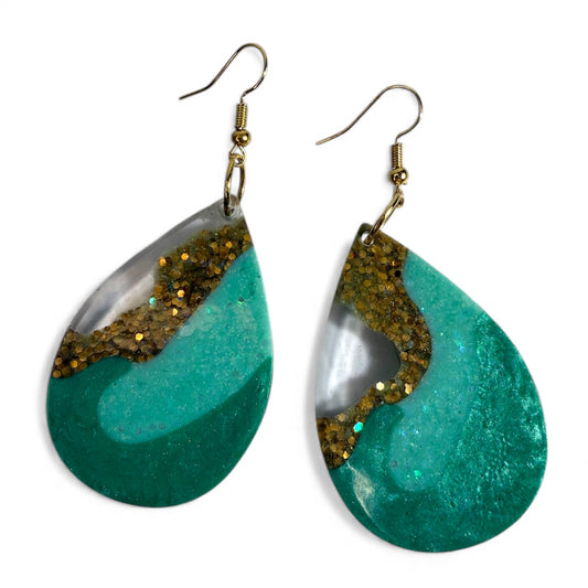 Teal geode resin dangle earrings with glossy sparkle finish.