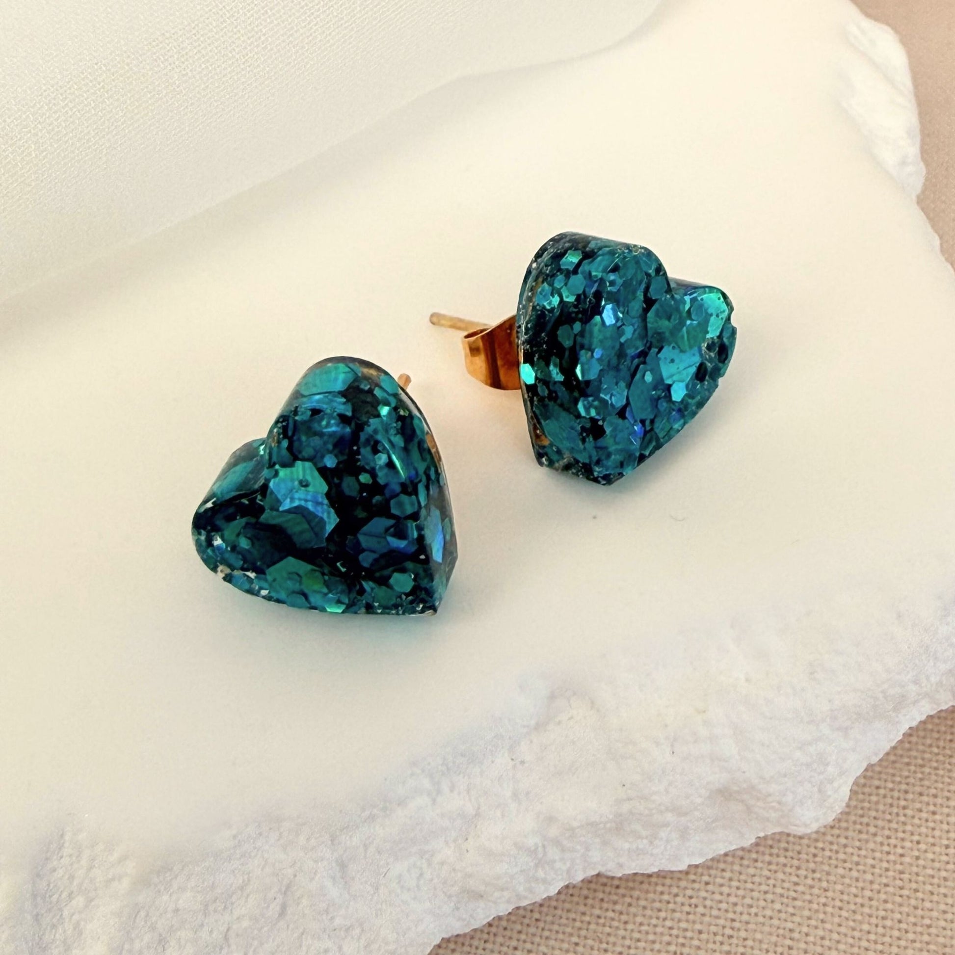 Australian handmade stud earrings Teal Heart in teal resin sparkle heart design.