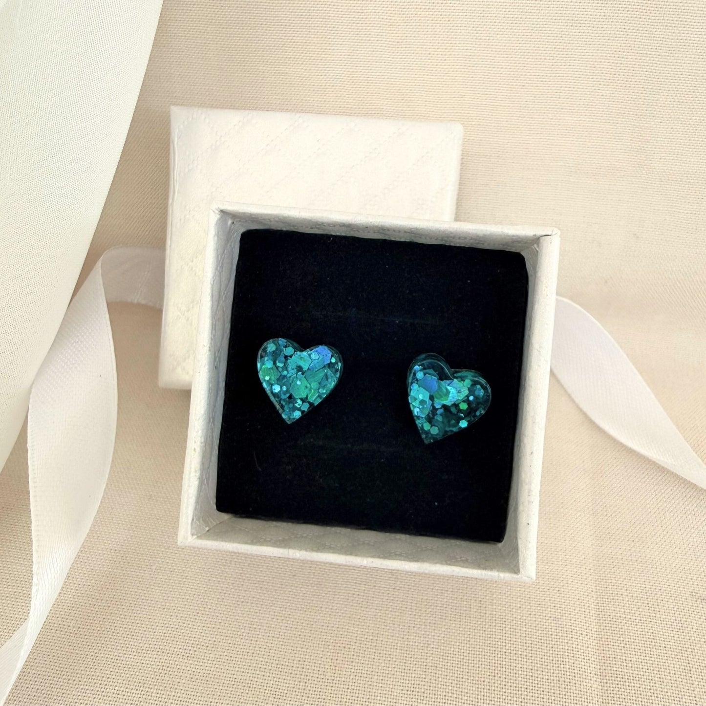 Australian handmade stud earrings Teal Heart presented in gift box with ribbon.