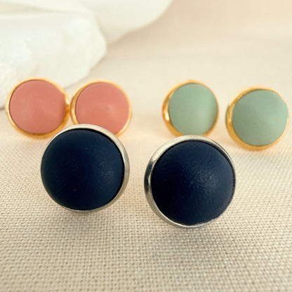 Close up of The Everyday Trio stud earrings showing smooth polymer clay finish and metal bezel details.