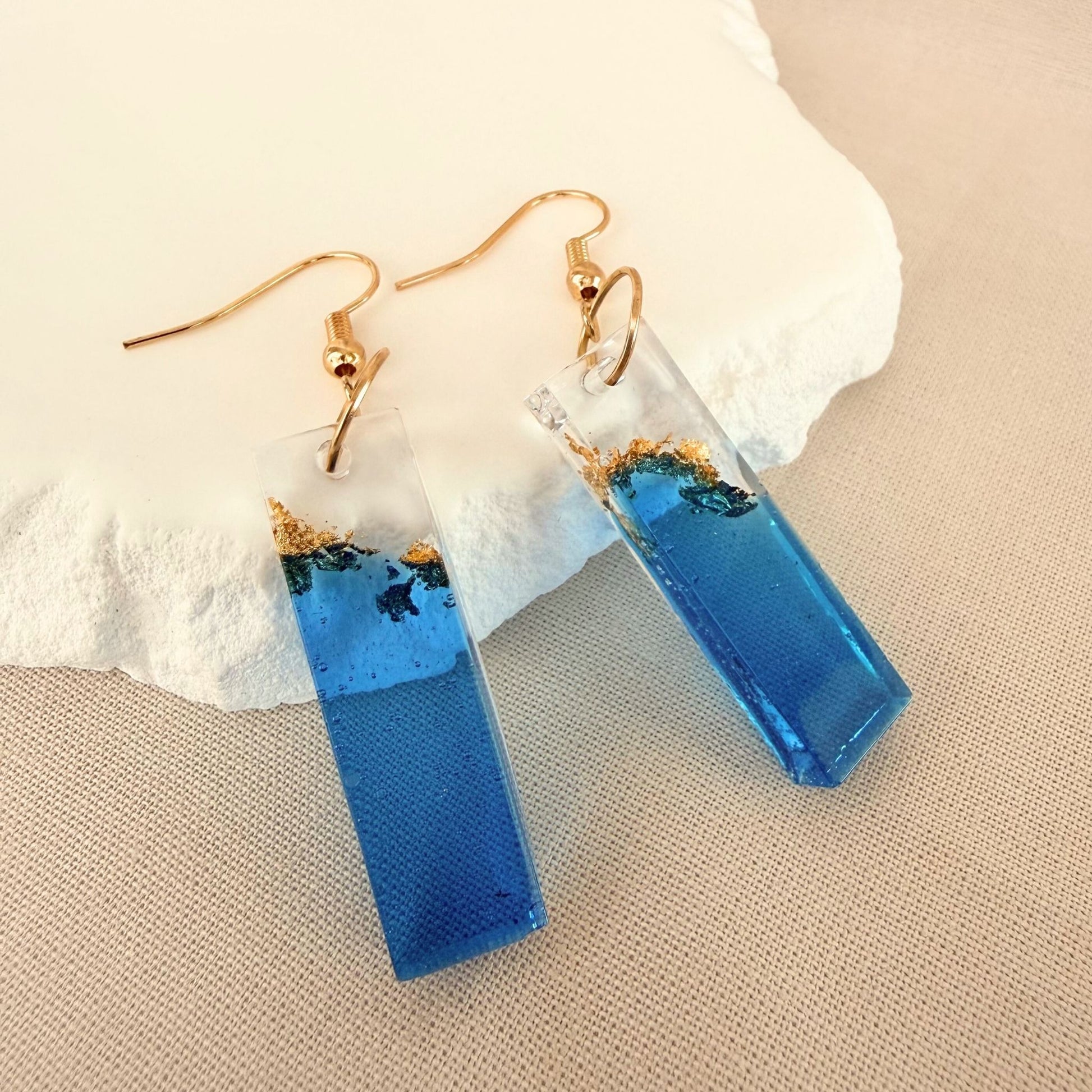Australian handmade dangle earrings Tidal Bar in blue and transparent resin with embedded gold leaf details