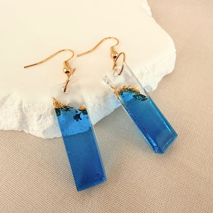 Australian handmade dangle earrings Tidal Bar in blue and transparent resin with embedded gold leaf details