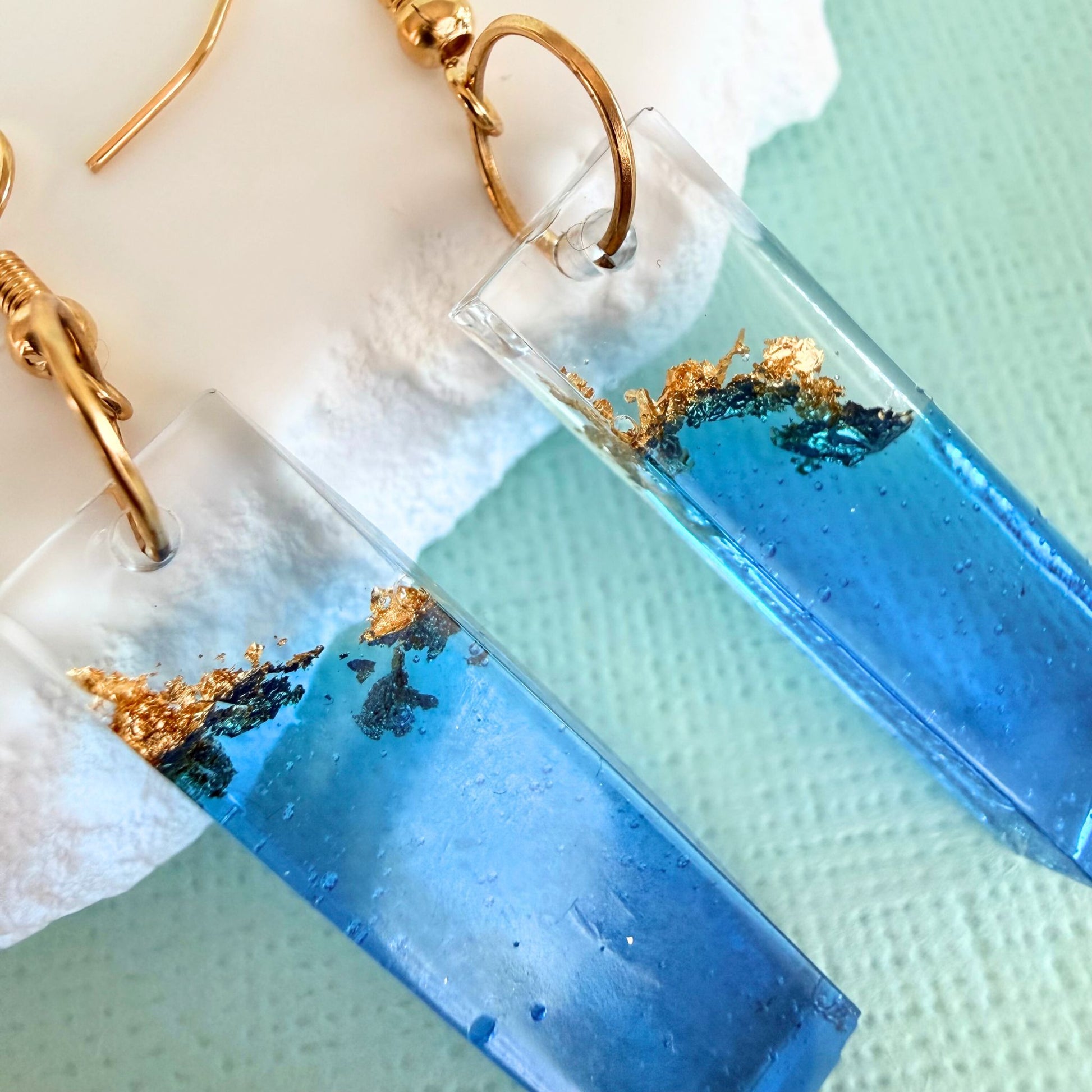 Close up of lightweight handmade dangle earrings Tidal Bar Sparkle 