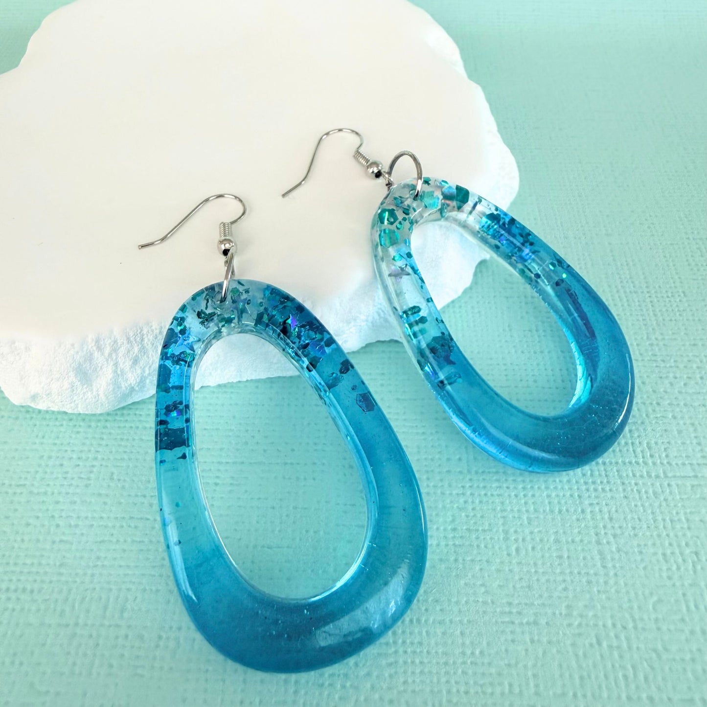 Australian handmade dangle earrings Tidal Glow Ovals in sparky resin