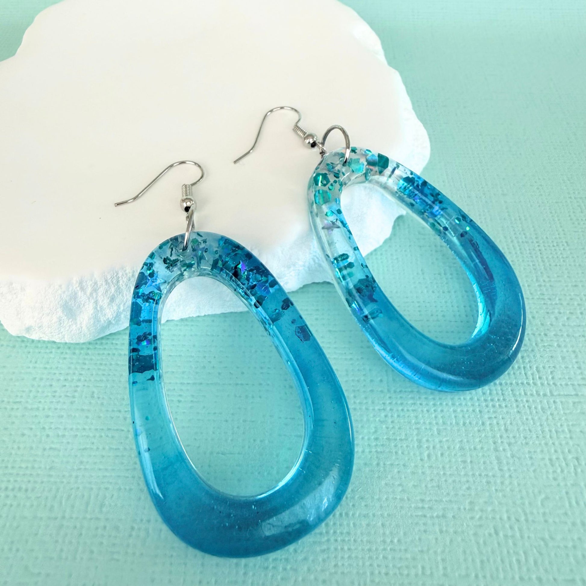 Australian handmade dangle earrings Tidal Glow Ovals in sparky resin
