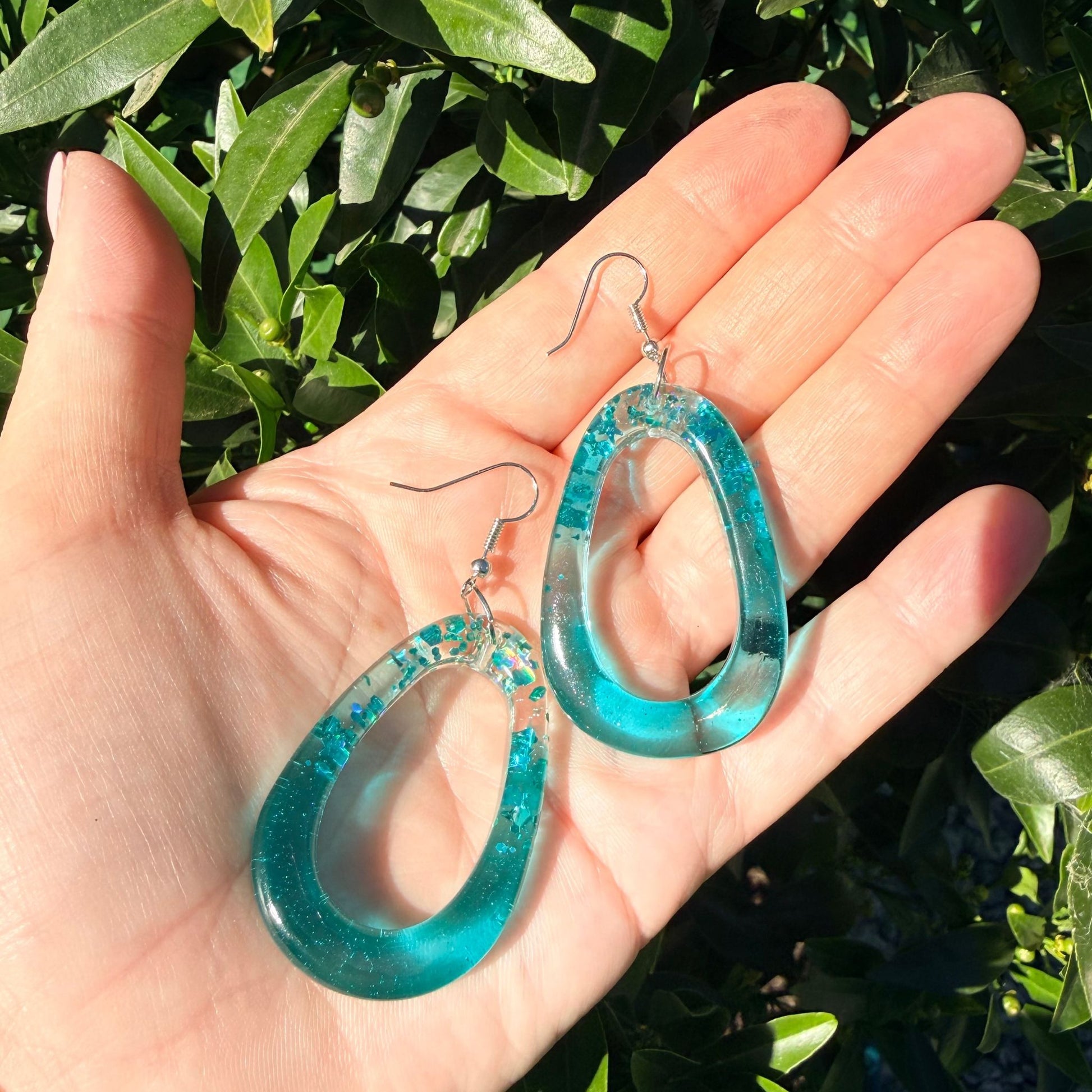 Handmade dangle earrings Tidal Glow Ovals shown to scale