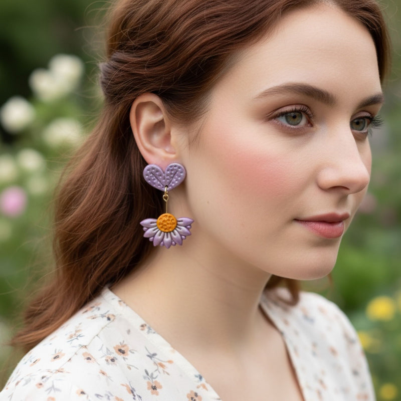 Australian handmade dangle earrings Violet Bloom worn by model showing playful movement
